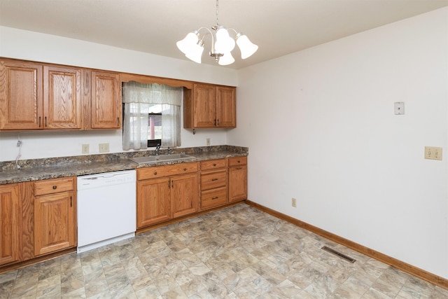 460 N 9th St, Carlisle, IA 50047 - kitchen with dishwasher, brown cabinetry, a chandelier, and dark countertops