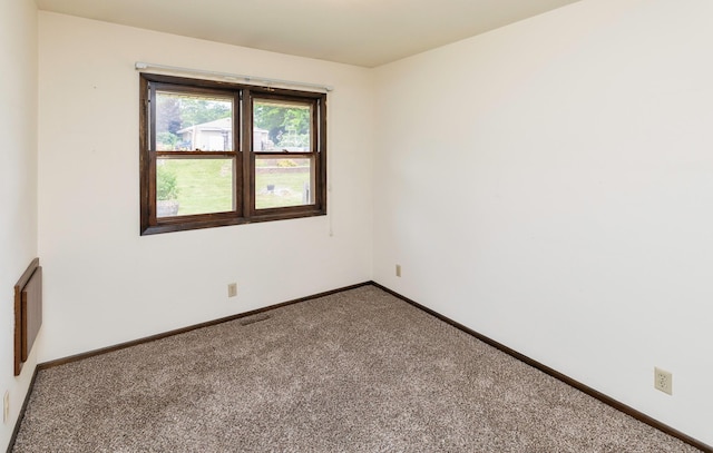 460 N 9th St, Carlisle, IA 50047 - carpeted spare room with baseboards
