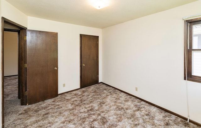 460 N 9th St, Carlisle, IA 50047 - unfurnished bedroom featuring carpet flooring and baseboards