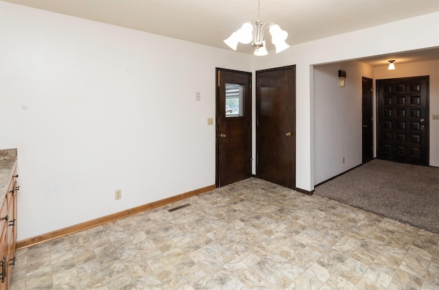 460 N 9th St, Carlisle, IA 50047 - unfurnished dining area featuring a chandelier and baseboards