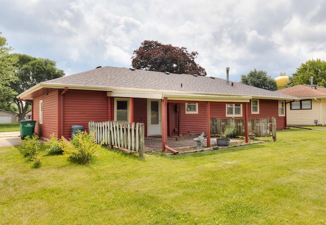 460 N 9th St, Carlisle, IA 50047 - rear view of house with a yard, a patio area, and a shingled roof