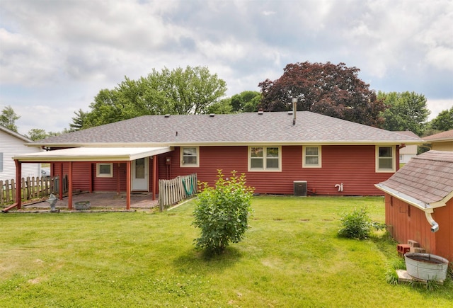 460 N 9th St, Carlisle, IA 50047 - rear view of property featuring a patio area, a storage shed, and roof with shingles