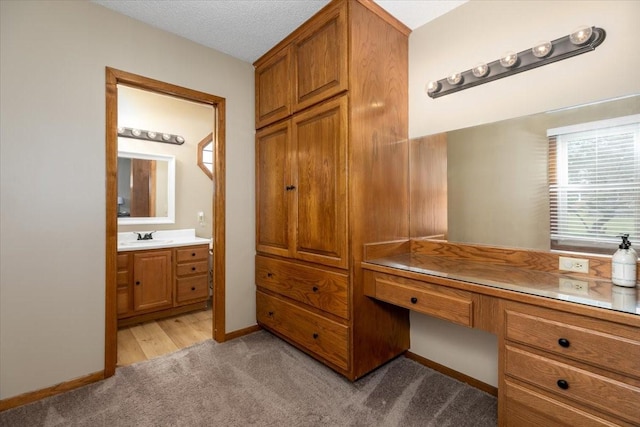 2325 61st St, Des Moines, IA 50322 - home office featuring built in study area and light carpet