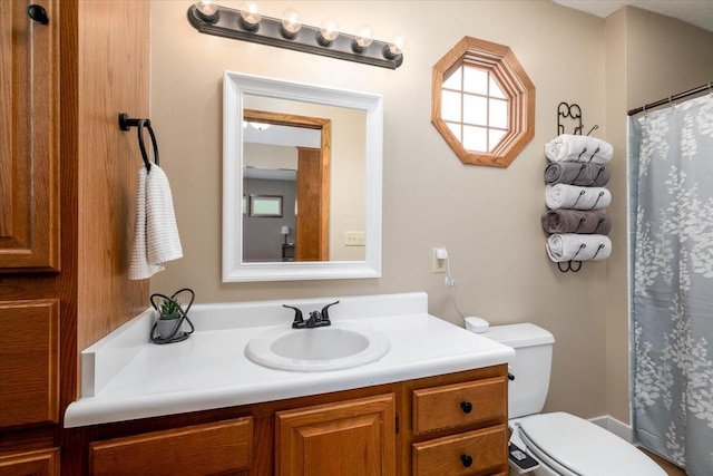 2325 61st St, Des Moines, IA 50322 - full bathroom with vanity and a shower with shower curtain
