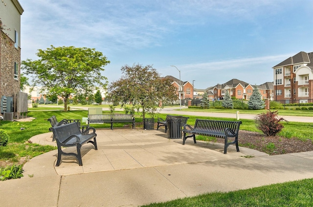6350 Coachlight Dr Unit 1308, West Des Moines, IA 50266 - view of community with a residential view, a yard, and a patio area