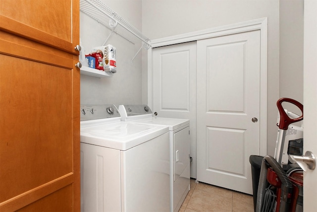 6350 Coachlight Dr Unit 1308, West Des Moines, IA 50266 - laundry room with independent washer and dryer and light tile patterned flooring