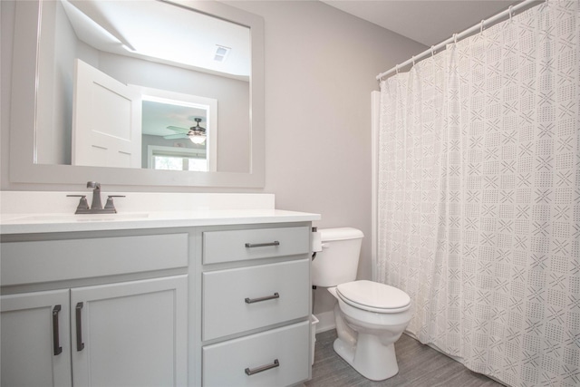 2416 NW Springbrooke Dr, Grimes, IA 50111 - bathroom with vanity, wood finished floors, a shower with curtain, and a ceiling fan