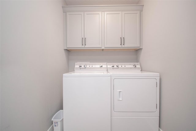 2416 NW Springbrooke Dr, Grimes, IA 50111 - washroom with washing machine and dryer and cabinet space