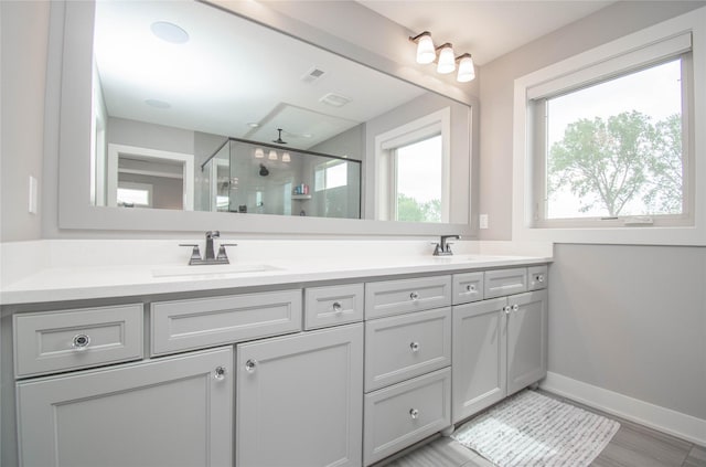 2416 NW Springbrooke Dr, Grimes, IA 50111 - bathroom featuring double vanity and a stall shower