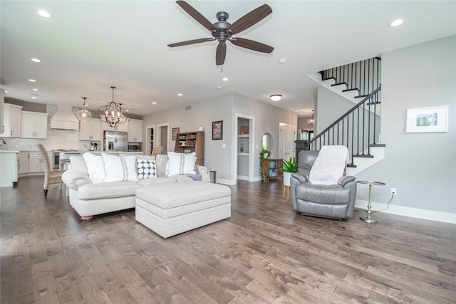 2416 NW Springbrooke Dr, Grimes, IA 50111 - living room with wood finished floors, ceiling fan, recessed lighting, and stairway
