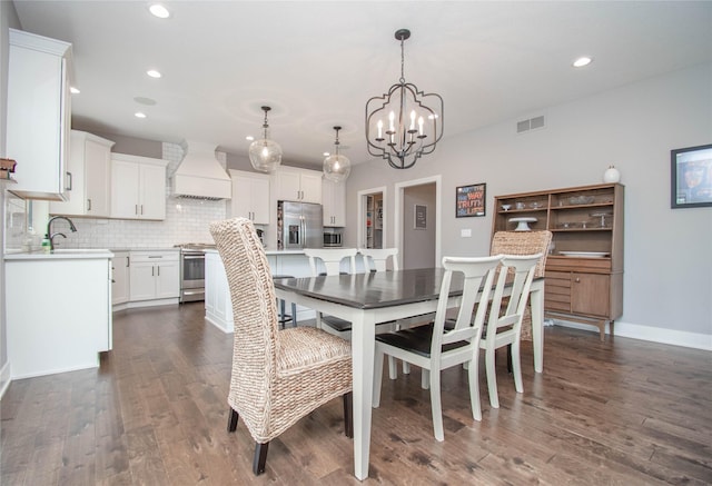 2416 NW Springbrooke Dr, Grimes, IA 50111 - dining space featuring a chandelier, recessed lighting, and dark wood finished floors