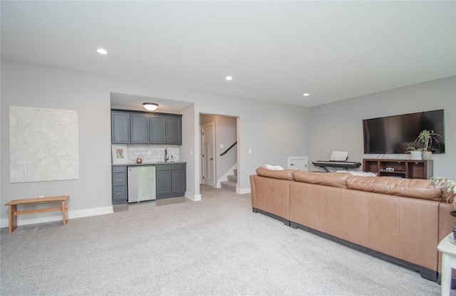 2416 NW Springbrooke Dr, Grimes, IA 50111 - living area featuring bar area, light colored carpet, stairs, and recessed lighting