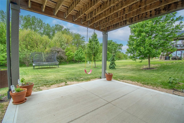 2416 NW Springbrooke Dr, Grimes, IA 50111 - view of patio featuring a trampoline and view of scattered trees