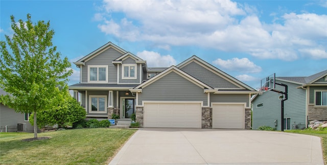 2416 NW Springbrooke Dr, Grimes, IA 50111 - craftsman inspired home with concrete driveway, a garage, a front lawn, and stone siding
