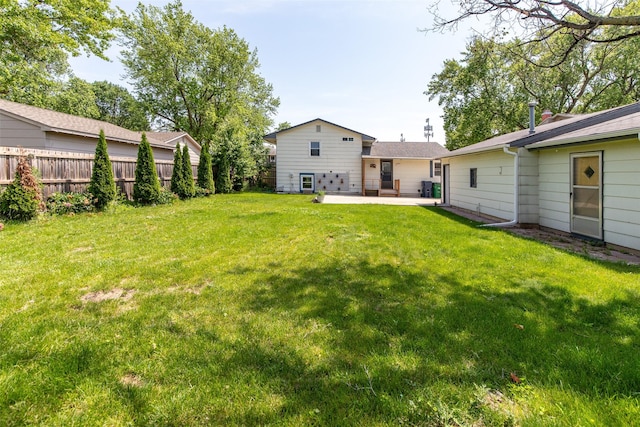 7013 Twana Dr, Urbandale, IA 50322 - view of yard with a patio area