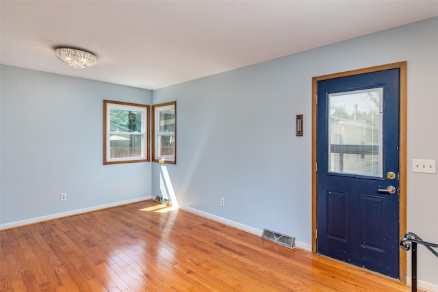 7013 Twana Dr, Urbandale, IA 50322 - foyer featuring light wood-style floors and baseboards