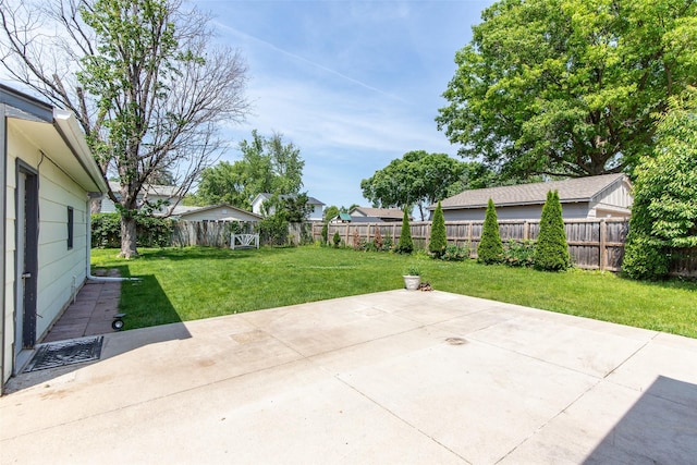 7013 Twana Dr, Urbandale, IA 50322 - fenced backyard with a patio