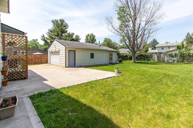 7013 Twana Dr, Urbandale, IA 50322 - fenced backyard with a garage and an outdoor structure
