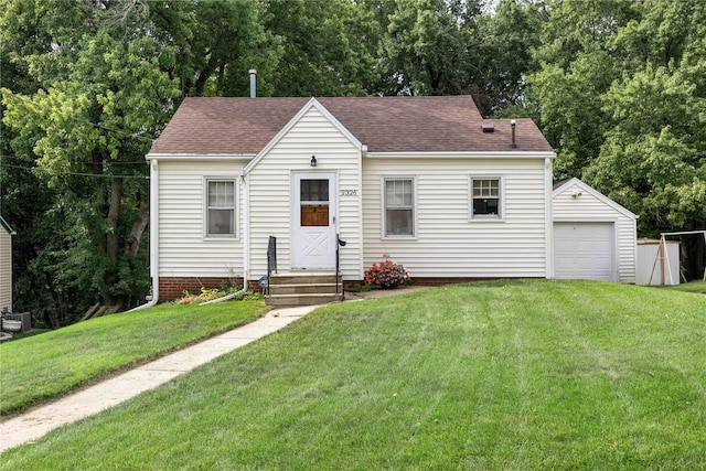 2326 Adams Ave, Des Moines, IA 50310 - view of front of home with an outdoor structure, a front lawn, entry steps, and roof with shingles