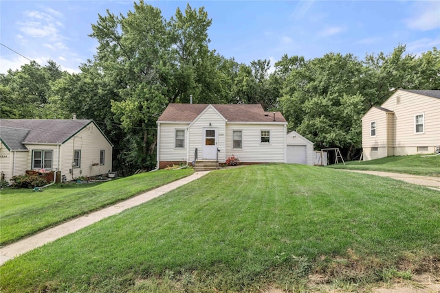 2326 Adams Ave, Des Moines, IA 50310 - view of front of house with an outdoor structure, a front yard, and a detached garage