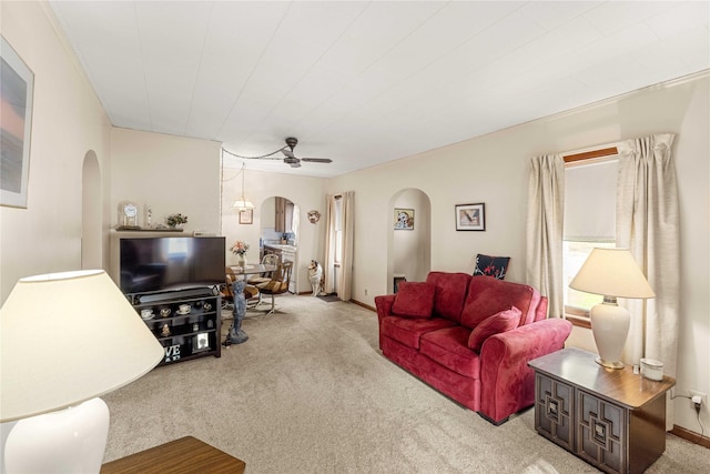 2326 Adams Ave, Des Moines, IA 50310 - carpeted living room with arched walkways and a ceiling fan