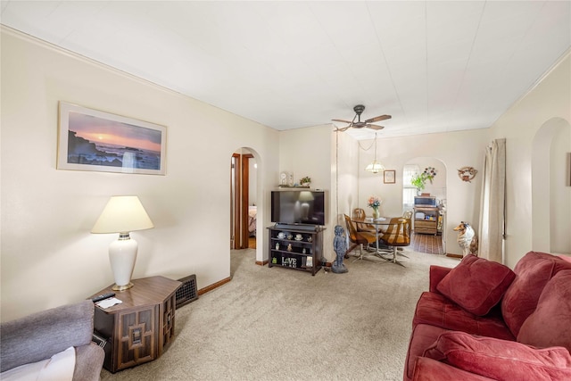 2326 Adams Ave, Des Moines, IA 50310 - living area featuring arched walkways, carpet, and a ceiling fan