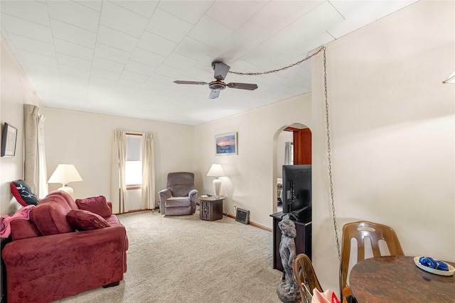 2326 Adams Ave, Des Moines, IA 50310 - carpeted living area with arched walkways and ceiling fan