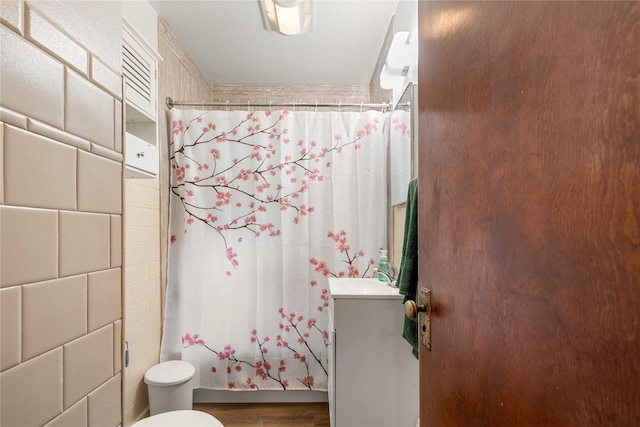 2326 Adams Ave, Des Moines, IA 50310 - full bath with vanity and tile walls