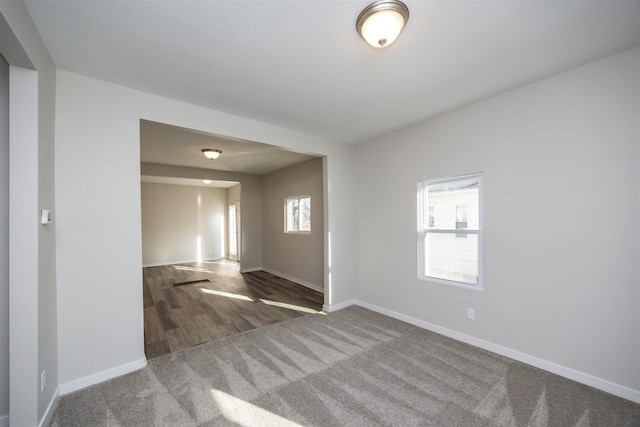 1332 E Sheridan Ave, Des Moines, IA 50316 - carpeted spare room featuring baseboards