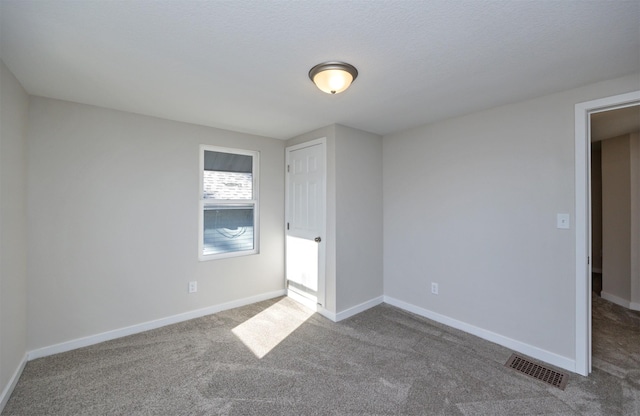 1332 E Sheridan Ave, Des Moines, IA 50316 - unfurnished bedroom featuring carpet flooring and baseboards