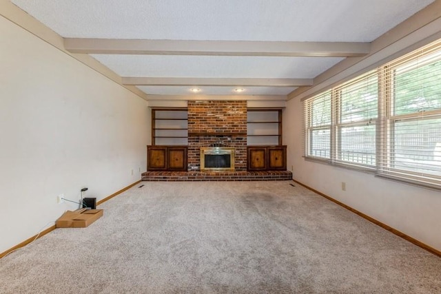 520 34th Pl, West Des Moines, IA 50265 - unfurnished living room with carpet floors, beamed ceiling, and a fireplace