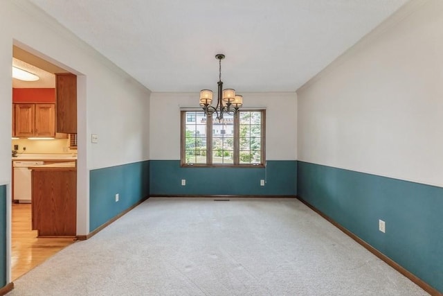 520 34th Pl, West Des Moines, IA 50265 - unfurnished room with a chandelier, light colored carpet, and crown molding