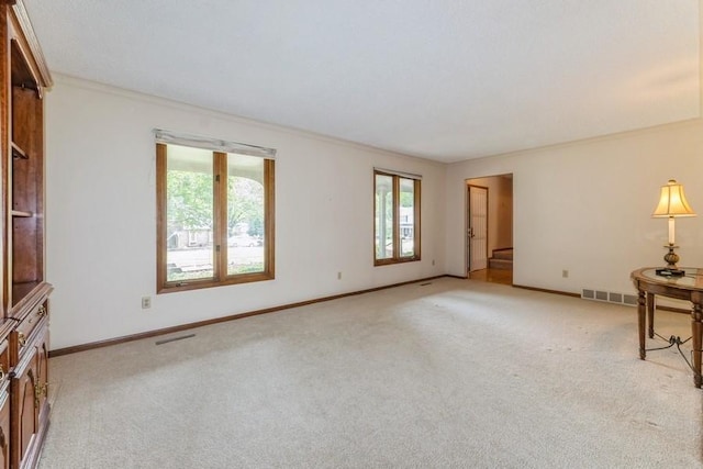 520 34th Pl, West Des Moines, IA 50265 - unfurnished living room featuring healthy amount of natural light, light colored carpet, and ornamental molding