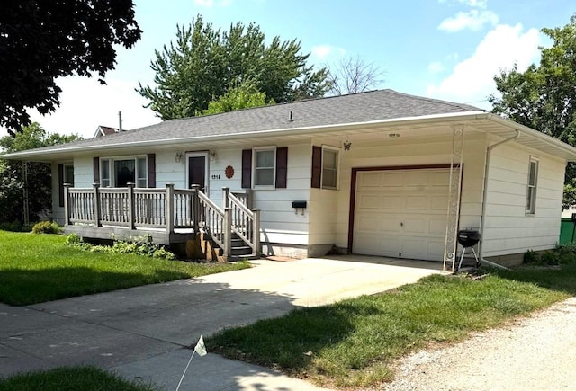 1315 First St, Boone, IA 50036 - ranch-style house featuring an attached garage, concrete driveway, and a front yard