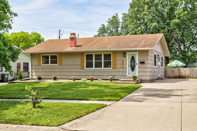 1621 Carroll Ave, Ames, IA 50010 - view of front of house featuring a chimney, a shingled roof, driveway, and entry steps