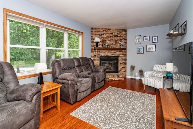 1621 Carroll Ave, Ames, IA 50010 - living room featuring wood finished floors and a fireplace