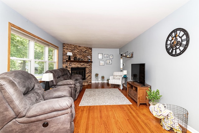 1621 Carroll Ave, Ames, IA 50010 - living area featuring light wood-type flooring and a fireplace