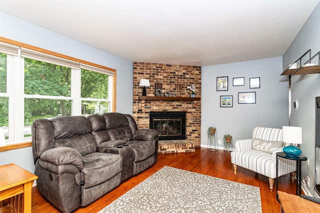 1621 Carroll Ave, Ames, IA 50010 - living area featuring a brick fireplace and wood finished floors