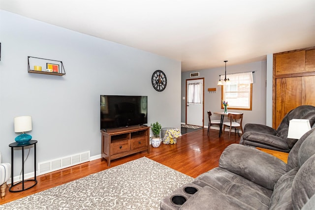 1621 Carroll Ave, Ames, IA 50010 - living area featuring wood finished floors and a chandelier