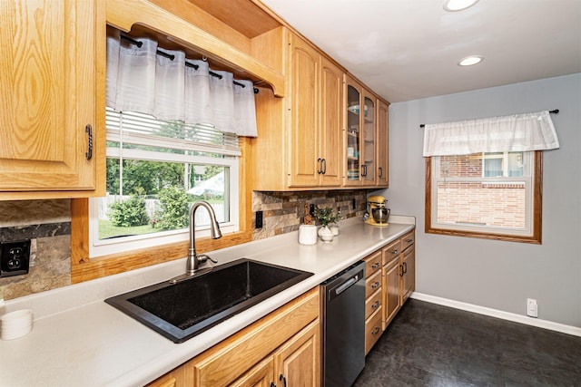 1621 Carroll Ave, Ames, IA 50010 - kitchen featuring dishwashing machine, backsplash, glass insert cabinets, light countertops, and recessed lighting