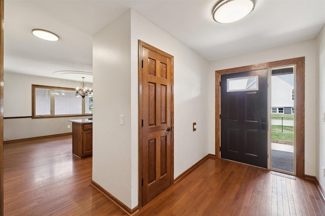 506 2nd Ave SW, Altoona, IA 50009 - entrance foyer featuring dark wood-style floors and a chandelier