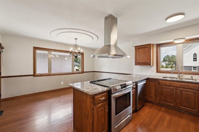 506 2nd Ave SW, Altoona, IA 50009 - kitchen featuring appliances with stainless steel finishes, island exhaust hood, plenty of natural light, and dark wood finished floors