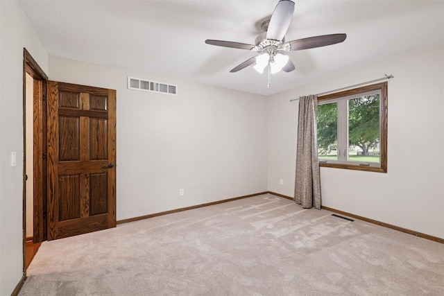 506 2nd Ave SW, Altoona, IA 50009 - unfurnished room with light colored carpet and ceiling fan