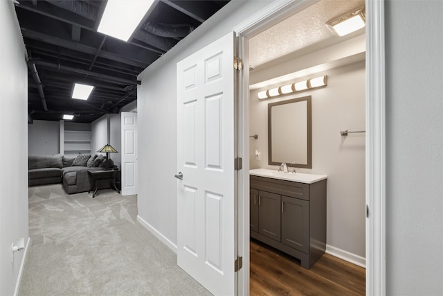 506 2nd Ave SW, Altoona, IA 50009 - hallway with a sink and baseboards
