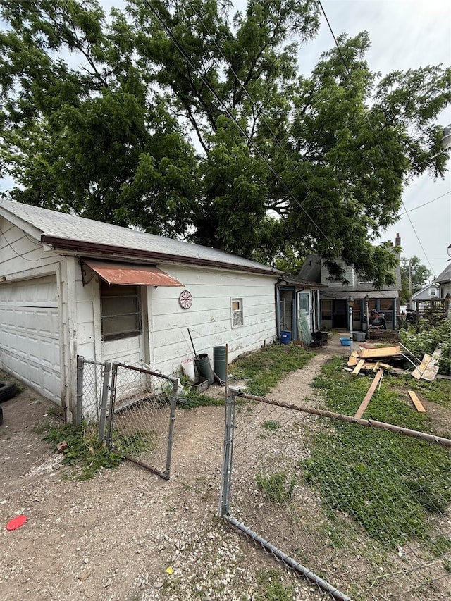 208 E 16th St, Des Moines, IA 50316 - view of side of property featuring a gate