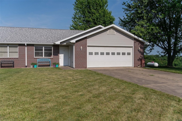 106 Park Ridge Dr, Otley, IA 50214 - ranch-style house with brick siding, an attached garage, driveway, and a front lawn