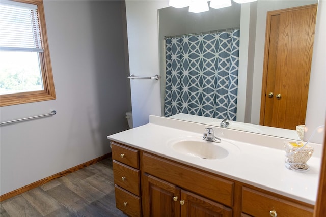 106 Park Ridge Dr, Otley, IA 50214 - full bath featuring wood finished floors, vanity, and curtained shower