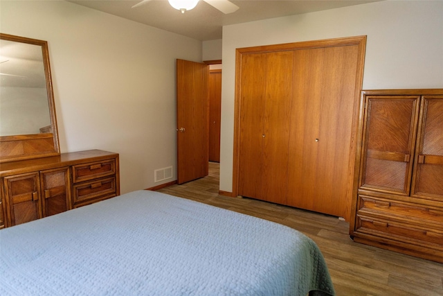 106 Park Ridge Dr, Otley, IA 50214 - bedroom featuring wood finished floors, a closet, and a ceiling fan