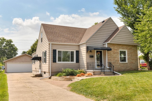 1808 60th St, Des Moines, IA 50322 - view of front facade with an outdoor structure, a shingled roof, a garage, and a front yard