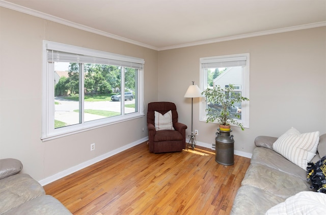 1808 60th St, Des Moines, IA 50322 - living area with healthy amount of natural light, light wood-style floors, and crown molding